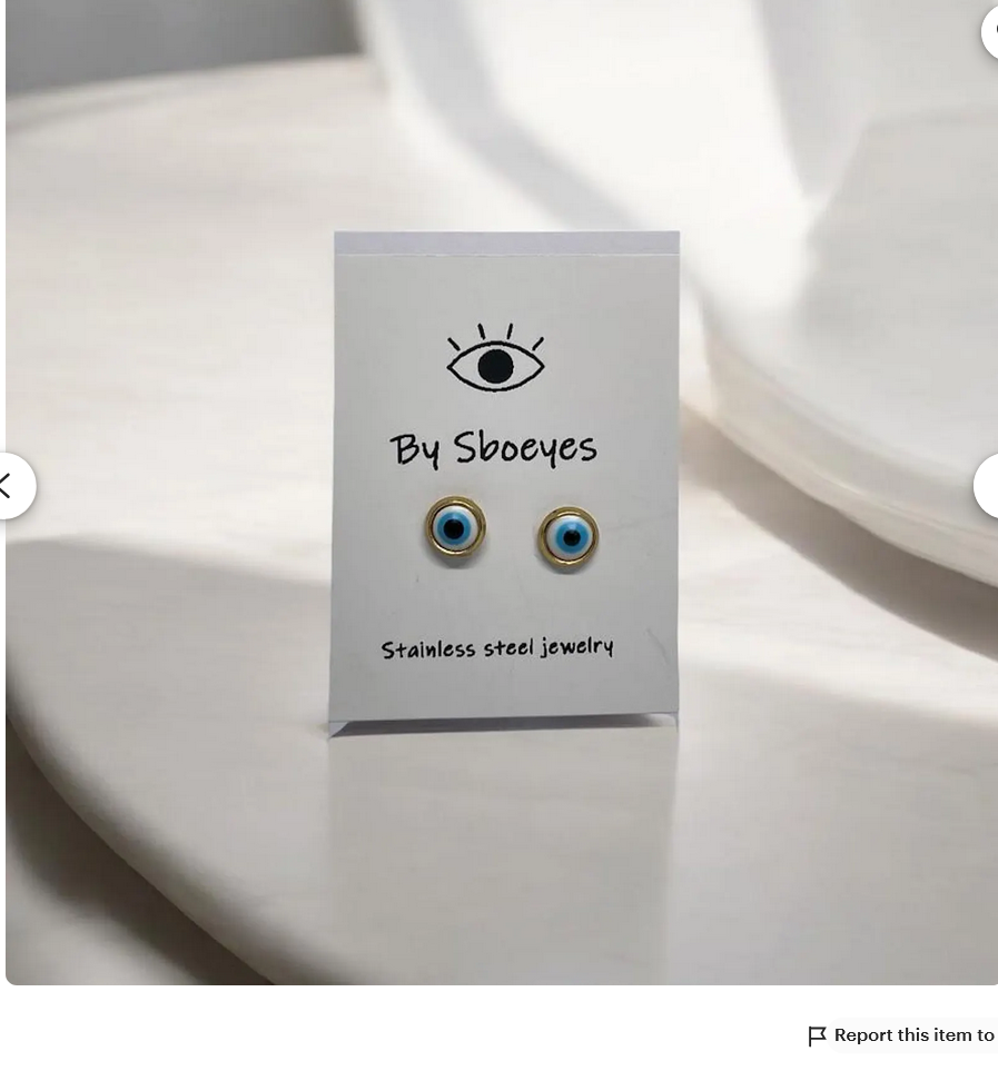 Boucles d'Oreilles Clous Oeil Blanc acier doré