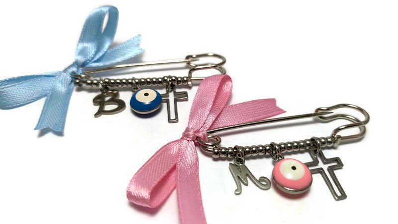Broche Protection bébé - Disponible en rose et bleu