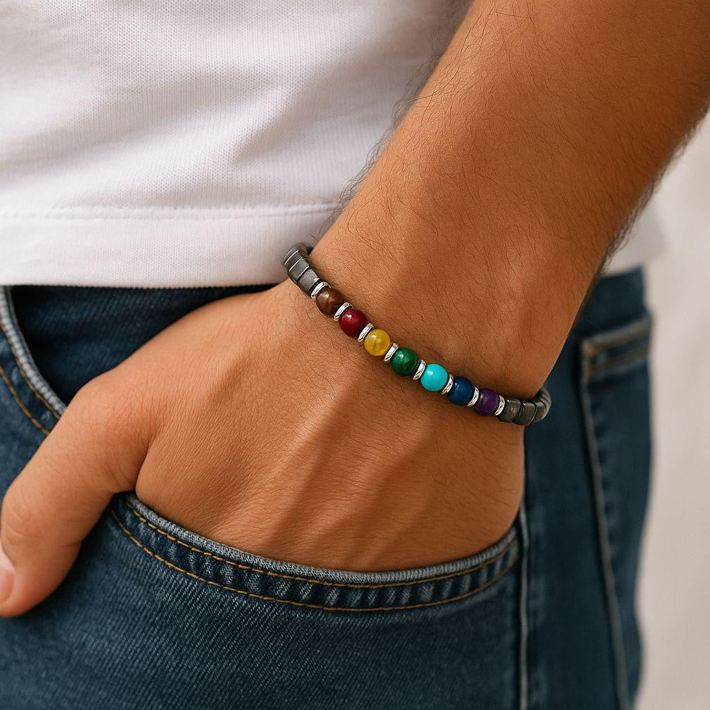 Multicolored beaded bracelet on a wrist with a white shirt and blue jeans background