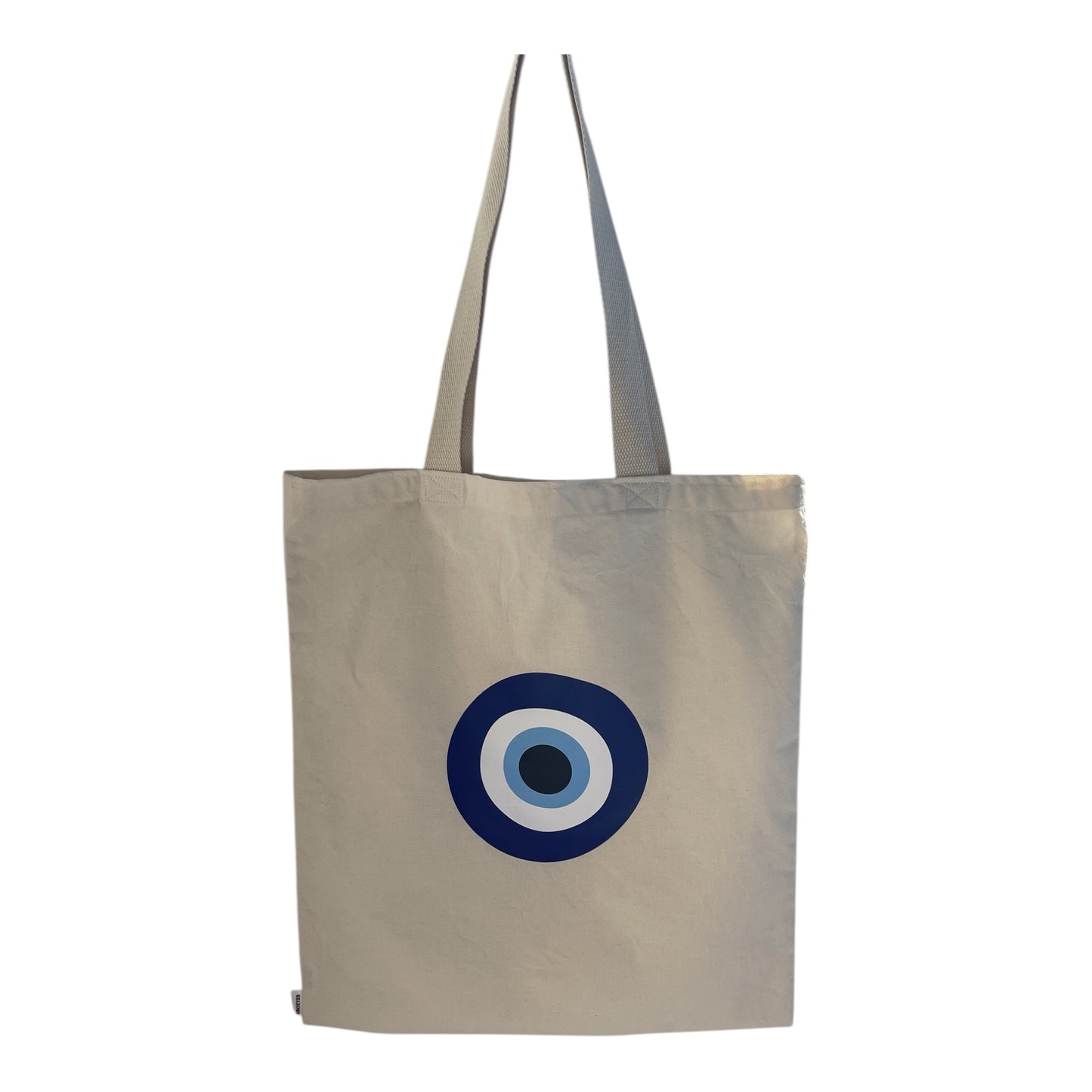 Beige tote bag with a blue and white circular design on a white background