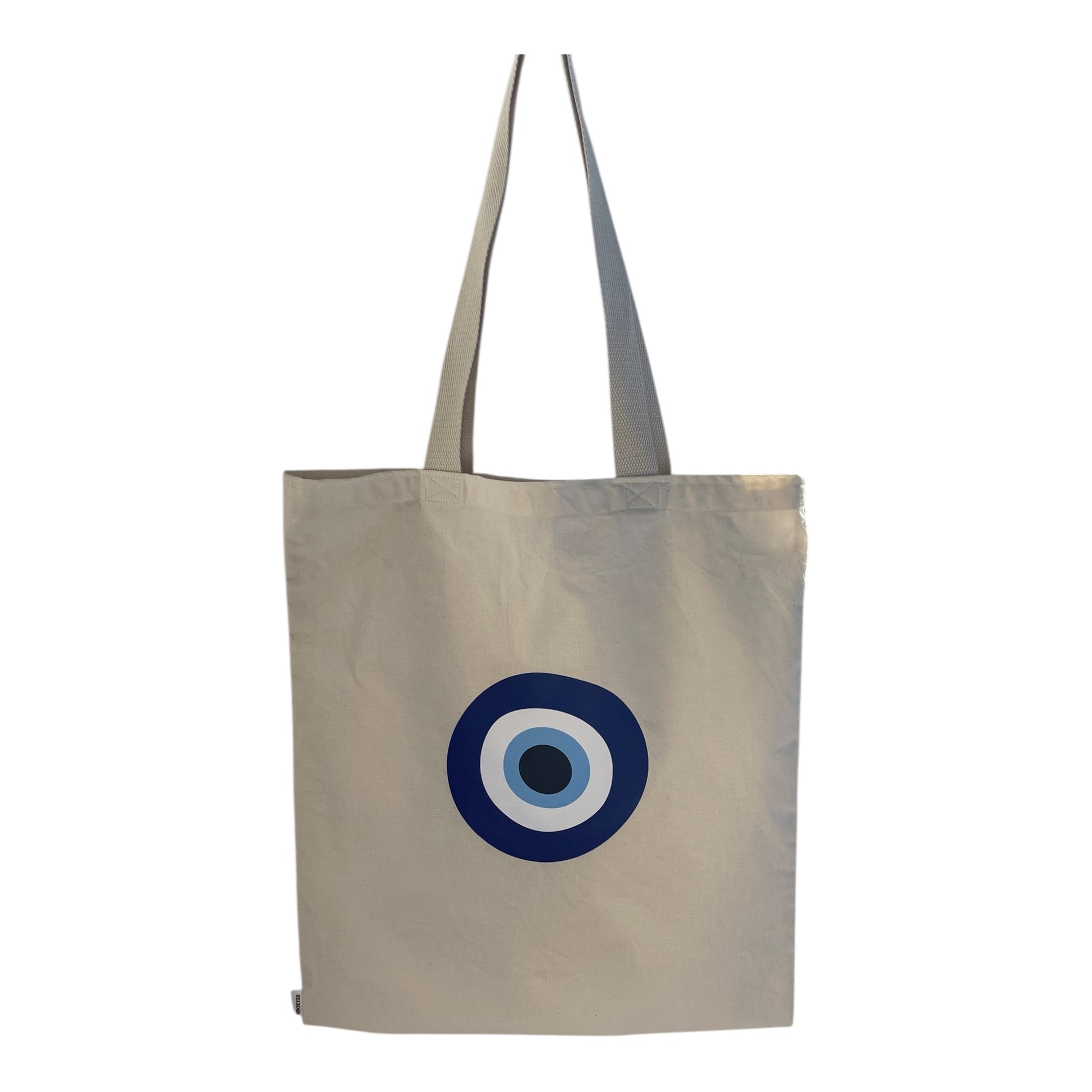 Beige tote bag with a blue and white circular design on a white background