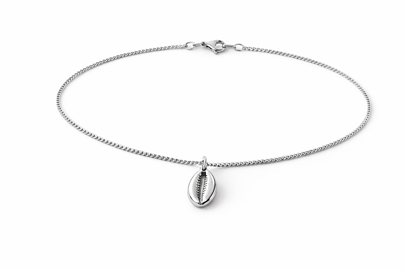Silver anklet with a shell pendant on a white background