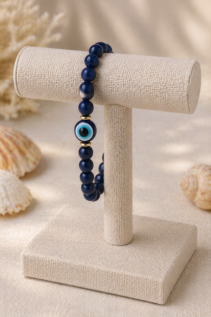 Elegant evil eye beaded bracelet on a stand