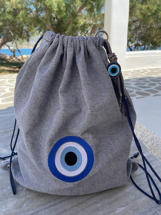Blue-Grey Denim Drawstring Backpack with Embroidered Evil Eye