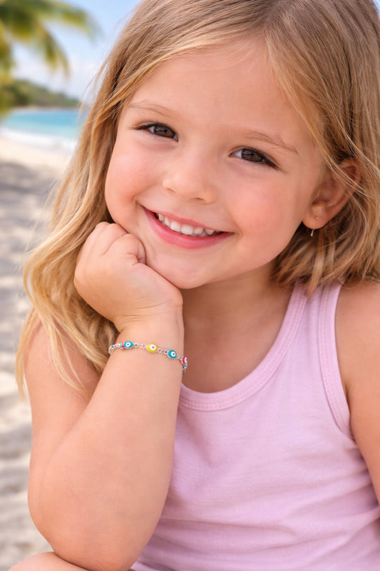 Adjustable baby and kids evil eye bracelet featuring a stainless steel enamel charm on a comfortable cord, a symbolic protection gift.