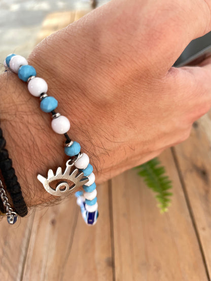 Handmade Greek evil eye phone charm with blue and white beads and stainless steel eye charm.