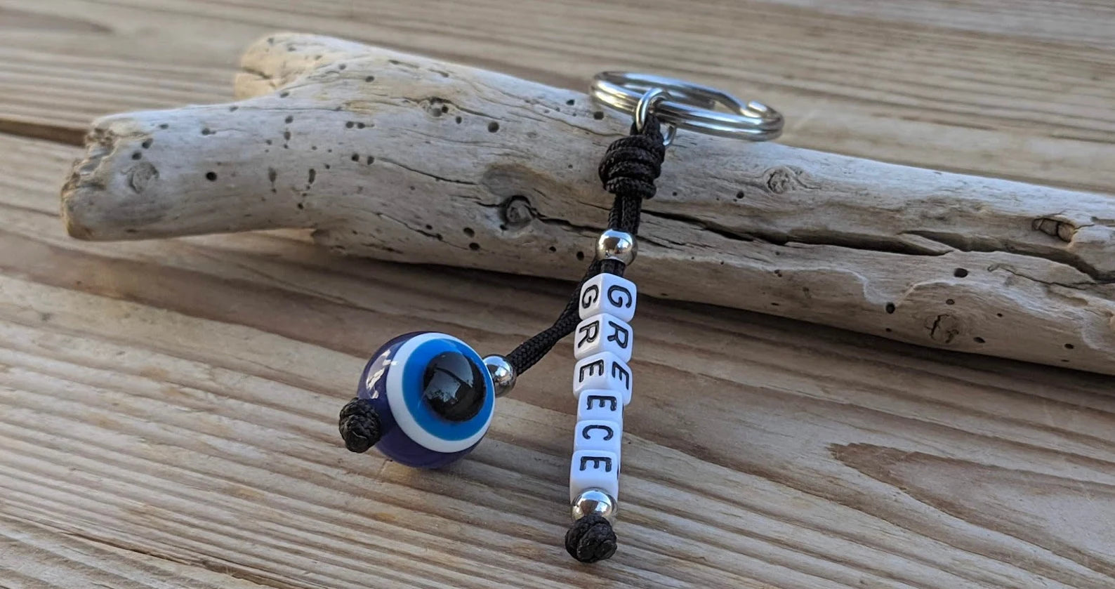 Keychain with 'Greece' beads on a piece of driftwood