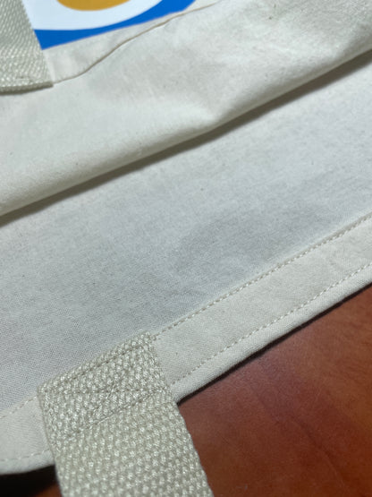 Close-up of a beige fabric with a textured pattern on a wooden surface