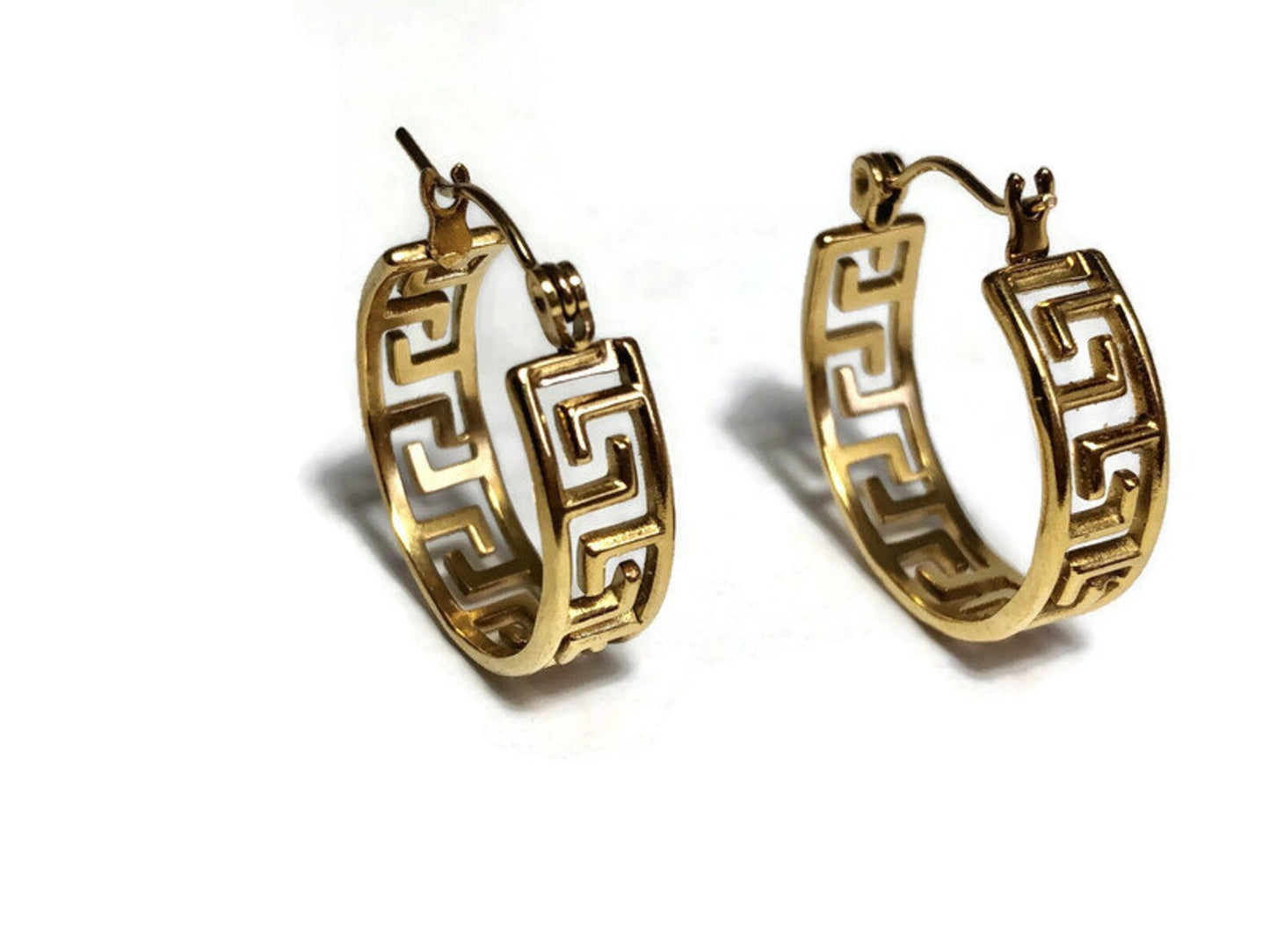 Gold hoop earrings with Greek key design on a white background