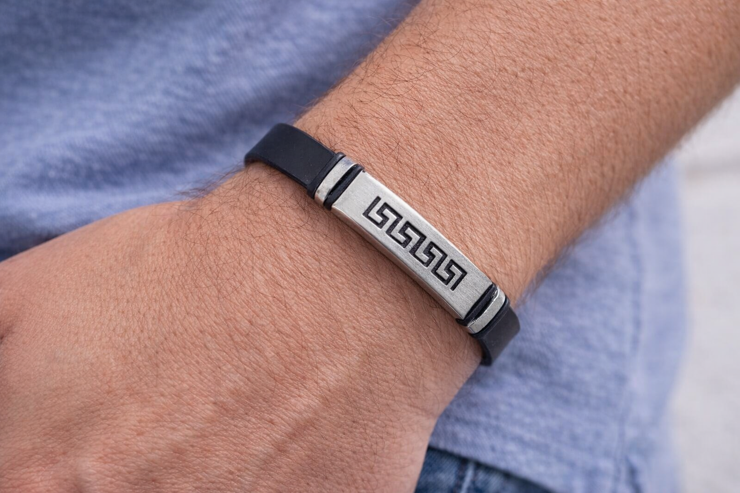 Greek key symbole on a black bracelet 
