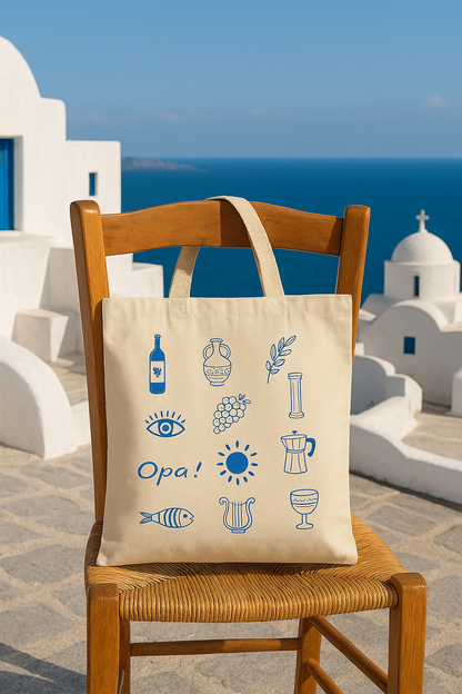 Tote bag with blue graphics and text on a chair in front of a scenic background