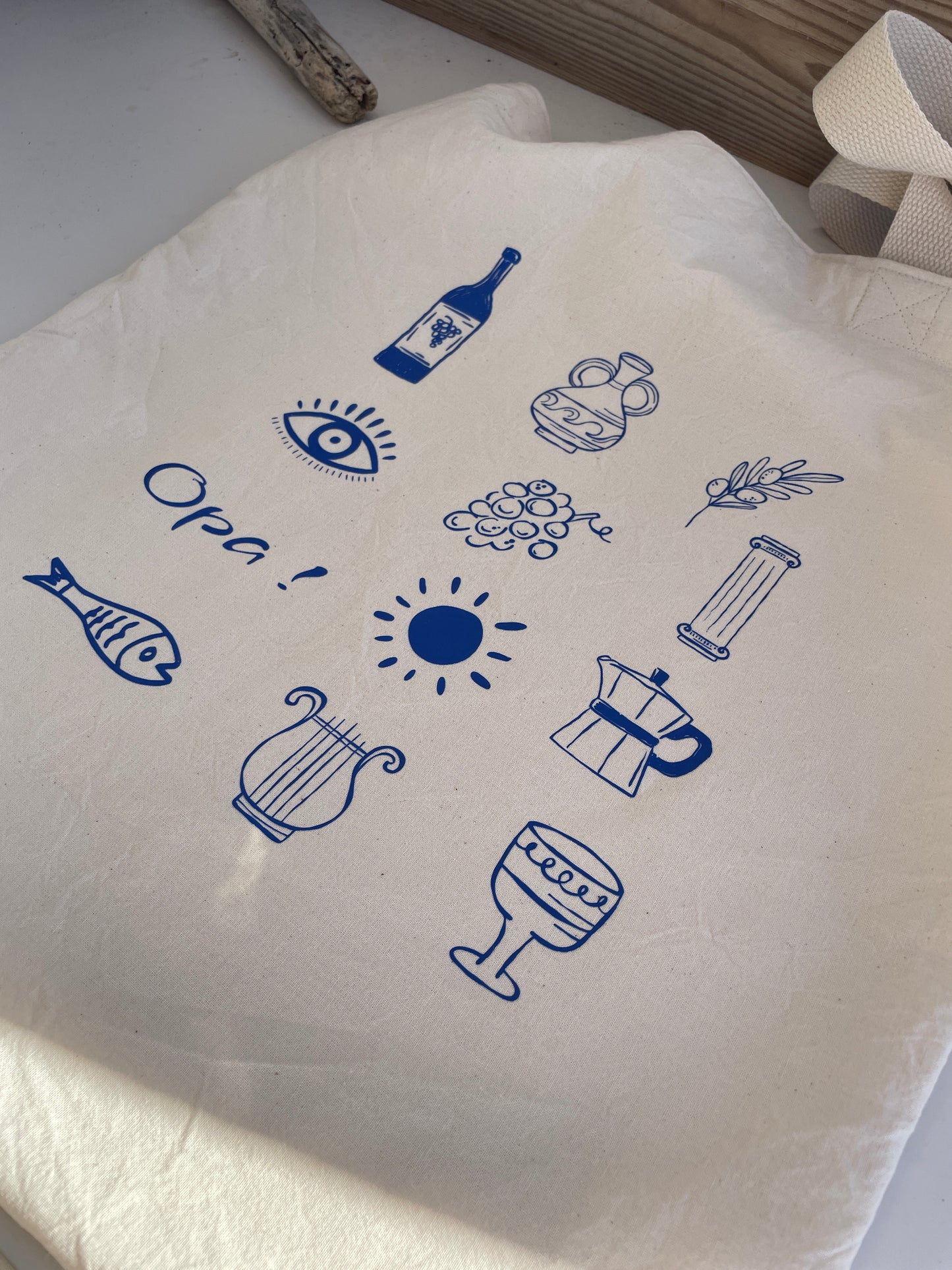 White bag with blue icons and text on a light background