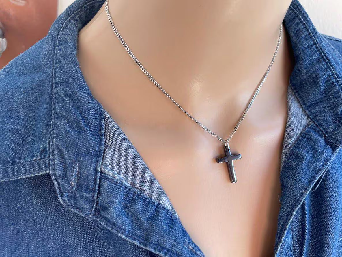Black hematite cross pendant necklace on a stainless steel chain, minimalist Christian jewelry for men and women.