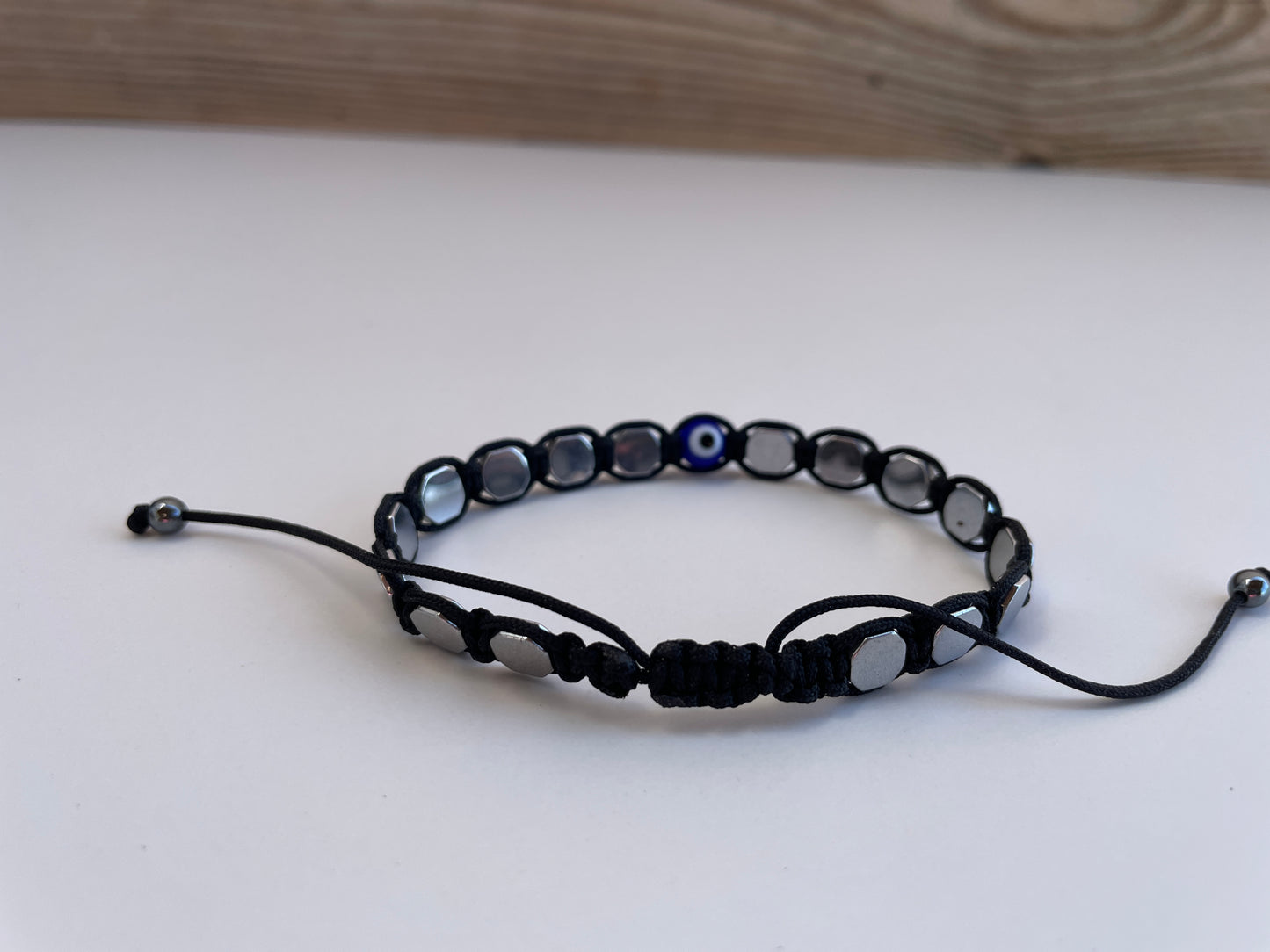 Blue Eye & Silver Hematite Bracelet – Protection & Elegance