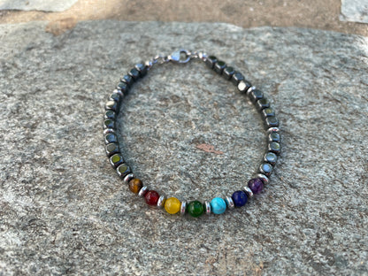 Beaded bracelet with multicolored beads on a stone surface