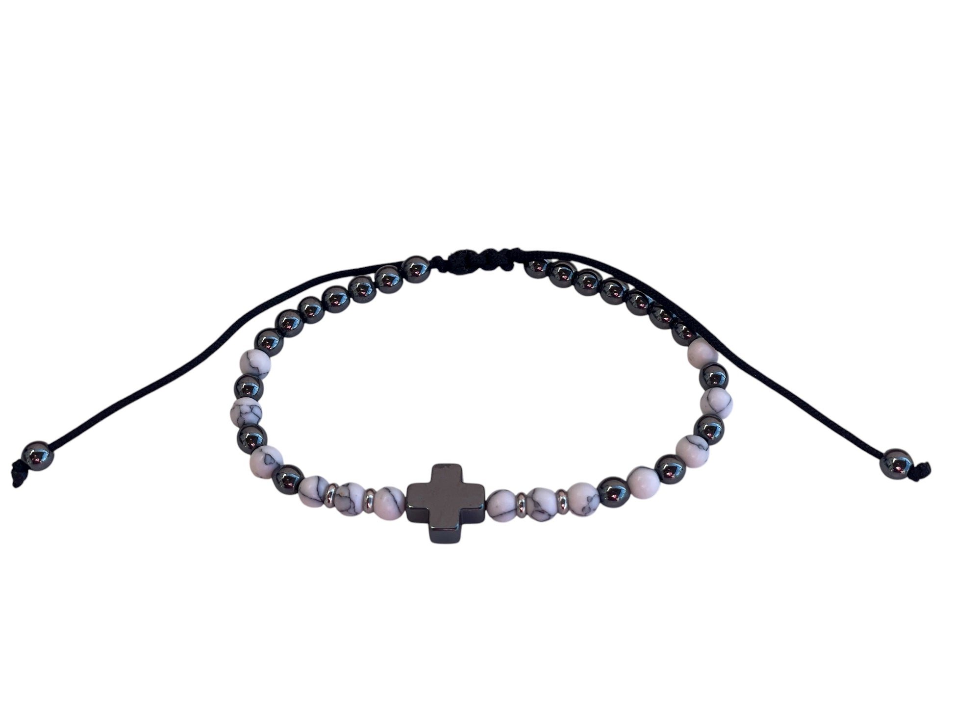 Beaded bracelet with a cross charm on a white background