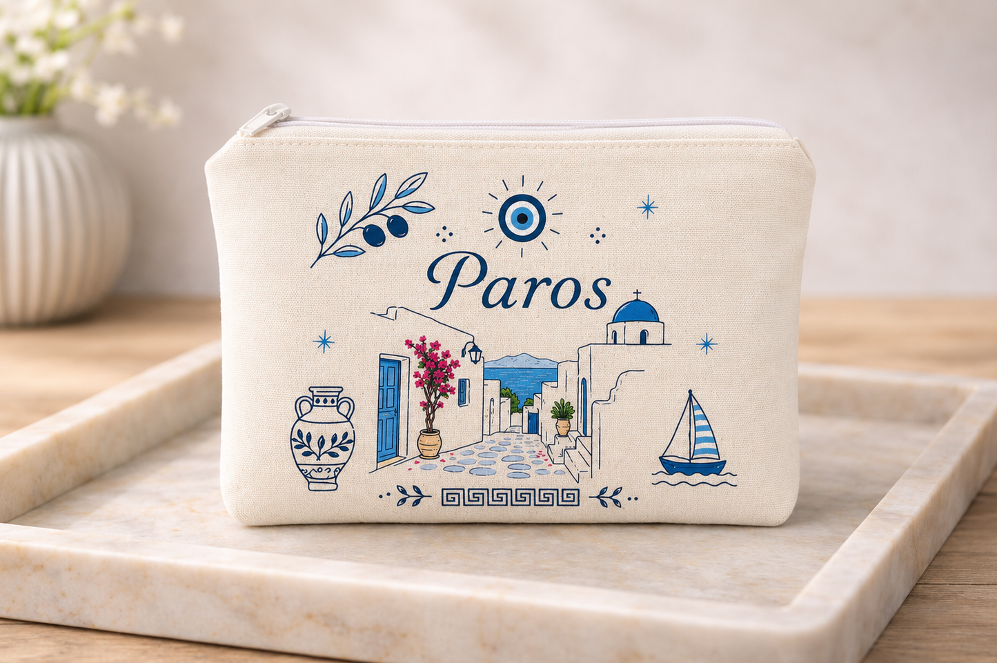 Pouch with 'Paros' design featuring Greek elements on a marble tray.