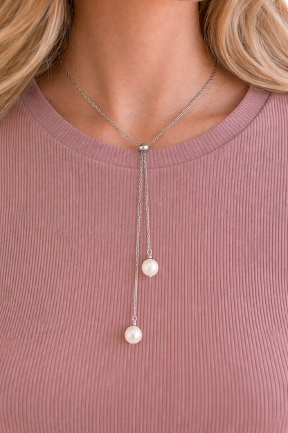 Detailed view of the Swarovski pearl and stainless steel Y chain, highlighting the minimalist bridal design.