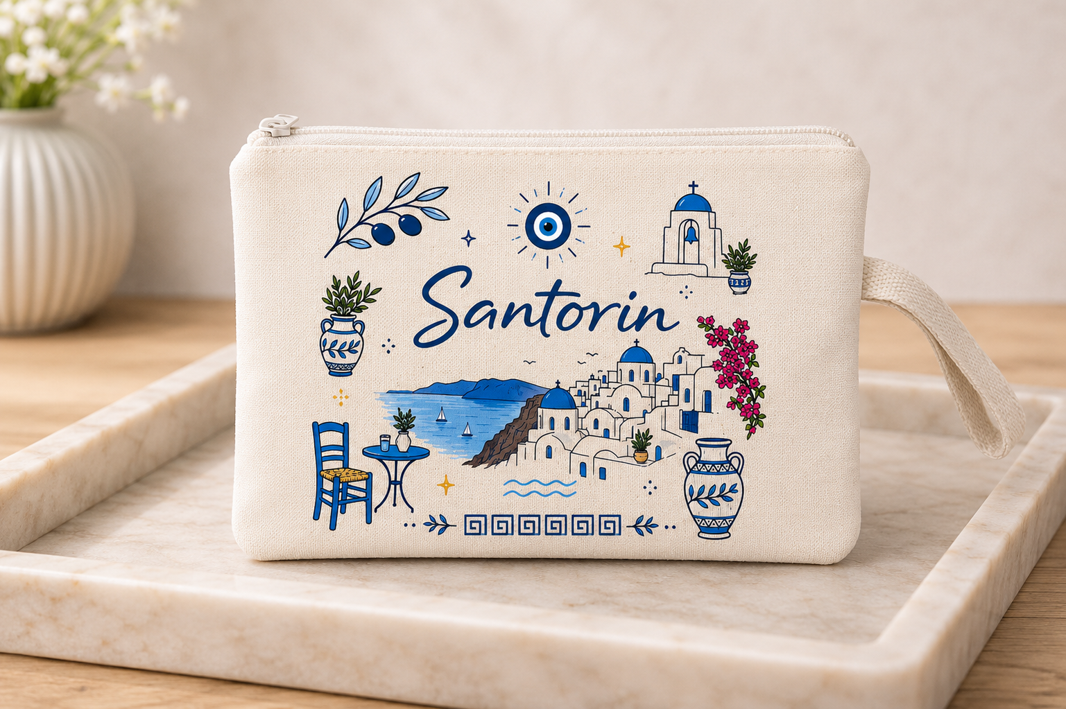 Pouch with Santorini-themed design on a marble surface