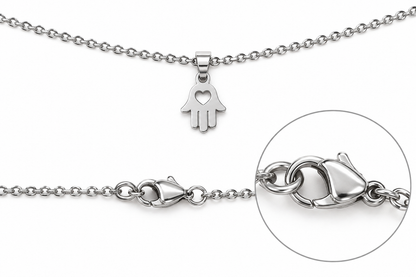 Silver Hamsa hand pendant necklace on a fine link chain, shown with a clasp detail and circular close-up inset on a white background.