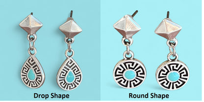 Two pairs of earrings, one with drop shape and the other with round shape, on a light blue background.