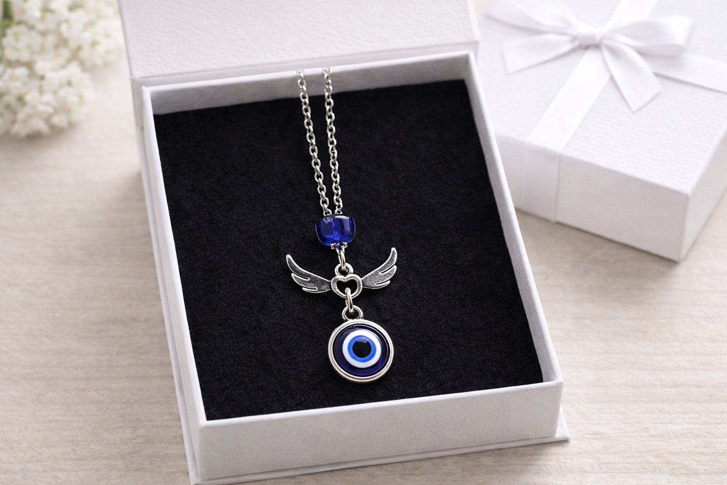 Bijou de rétroviseur ailes d'ange oeil bleu 