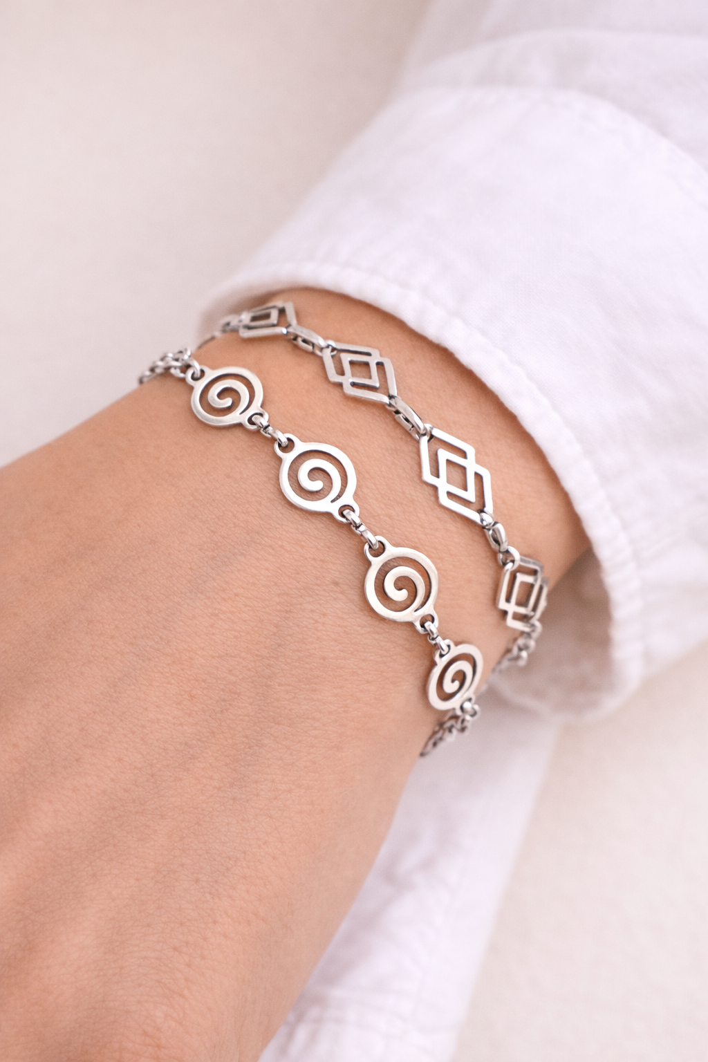 Adjustable stainless steel bracelet featuring a modern spiral or rhombus design on a durable cord, minimalist jewelry for everyday wear.