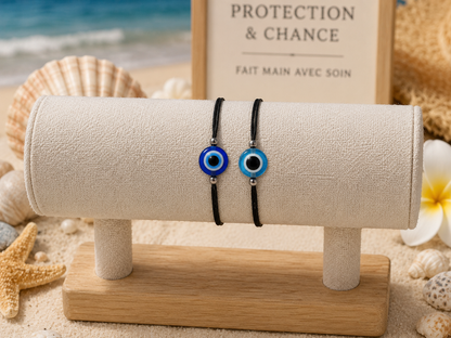 handmade--blue-evil-eye-bracelet-black-cord on a stand
