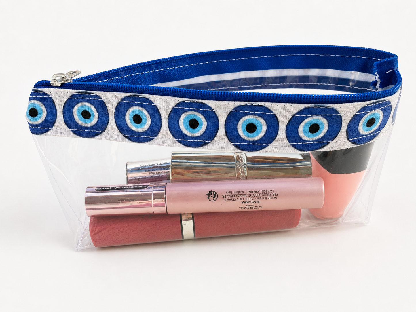 Clear PVC cosmetic bag with Greek evil eye trim and matching zipper charm.