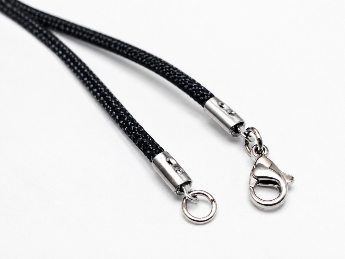 Black braided cord lanyard with silver metal clasp and split ring, shown on a clean white background.