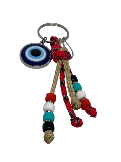 Keychain with evil eye charm and colorful beads on a white background