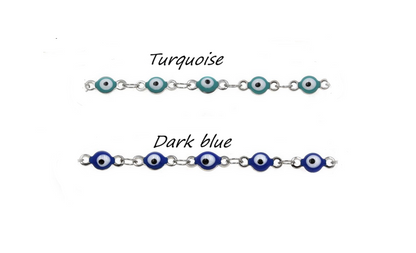 Two bracelets with blue and dark blue beads on a white background
