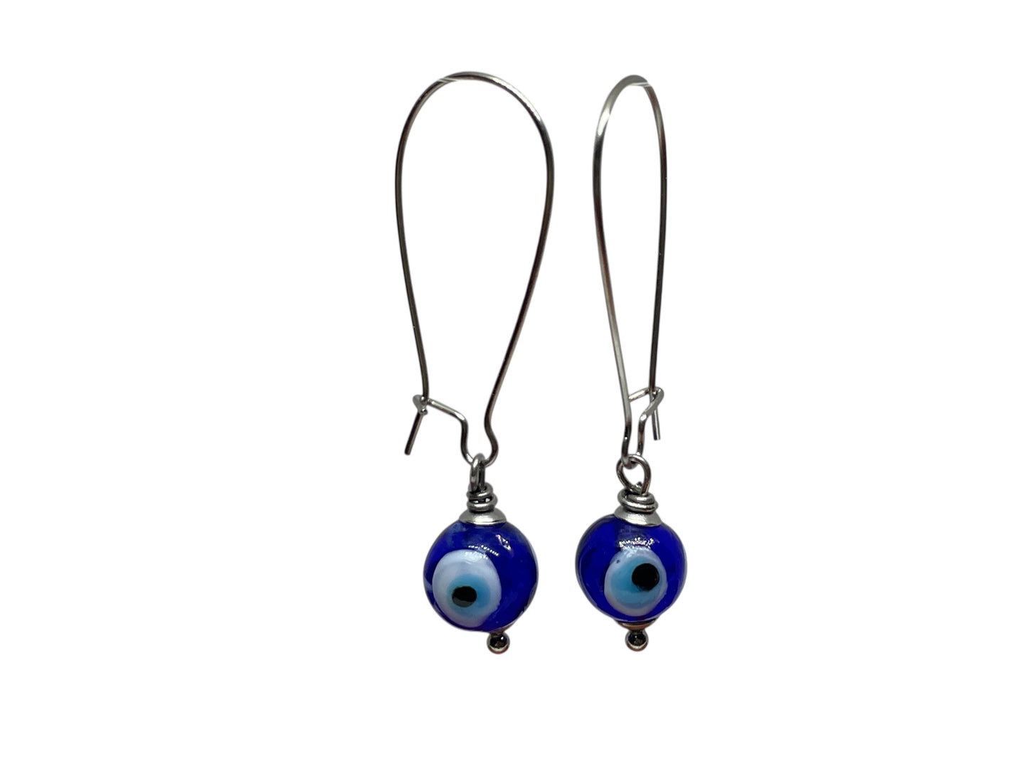 Pair of blue evil eye earrings on white background