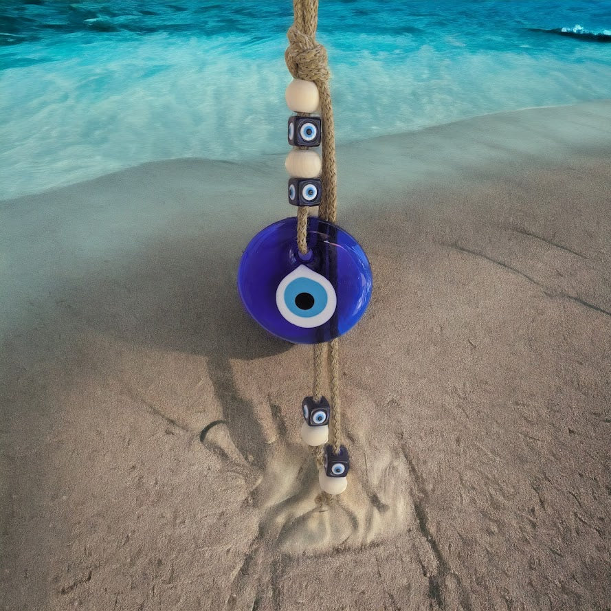 Decorative blue evil eye wall hanging for home entrance.