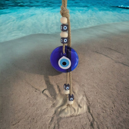 Decorative blue evil eye wall hanging for home entrance.