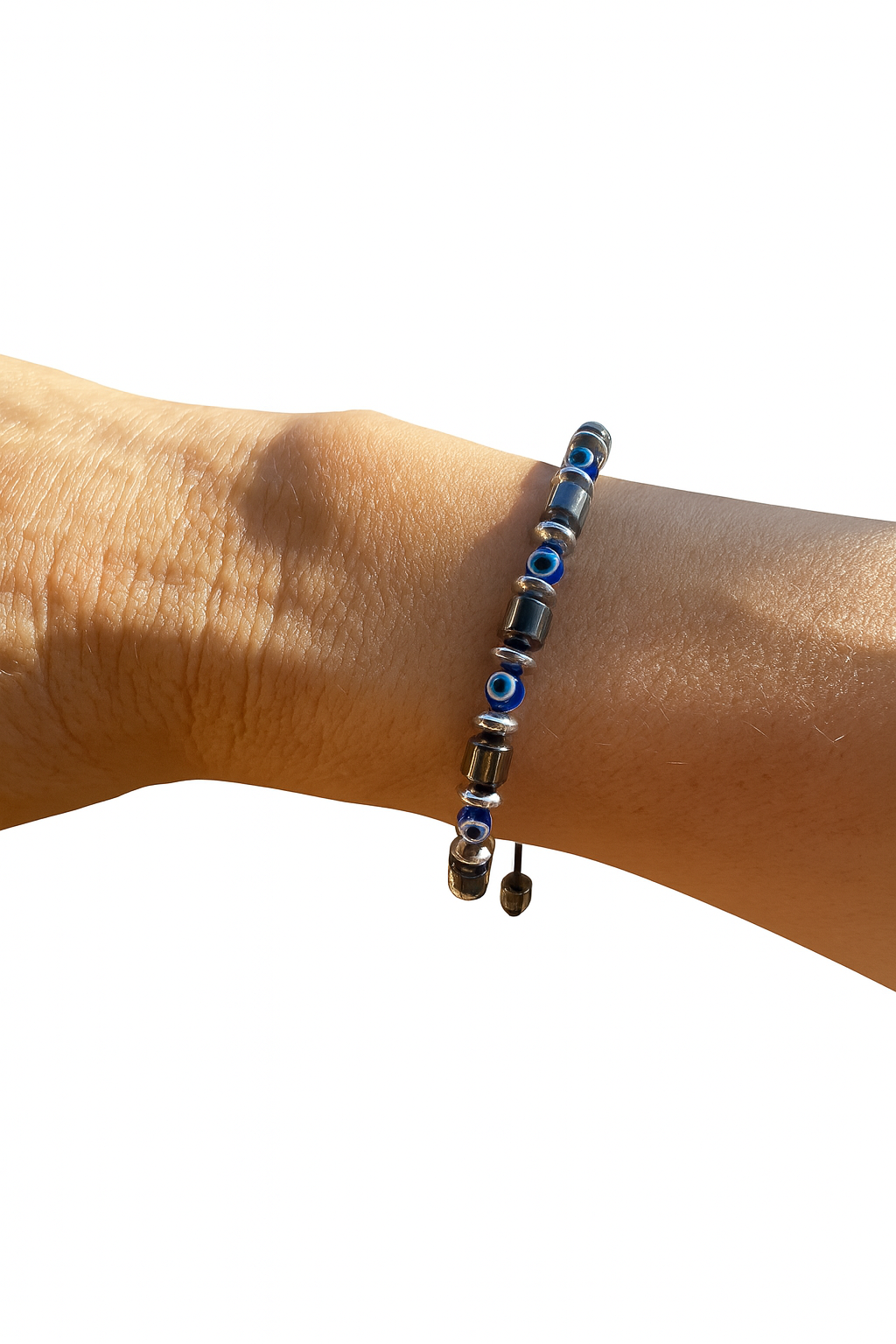Bracelet with blue and black beads on a wrist against a white background