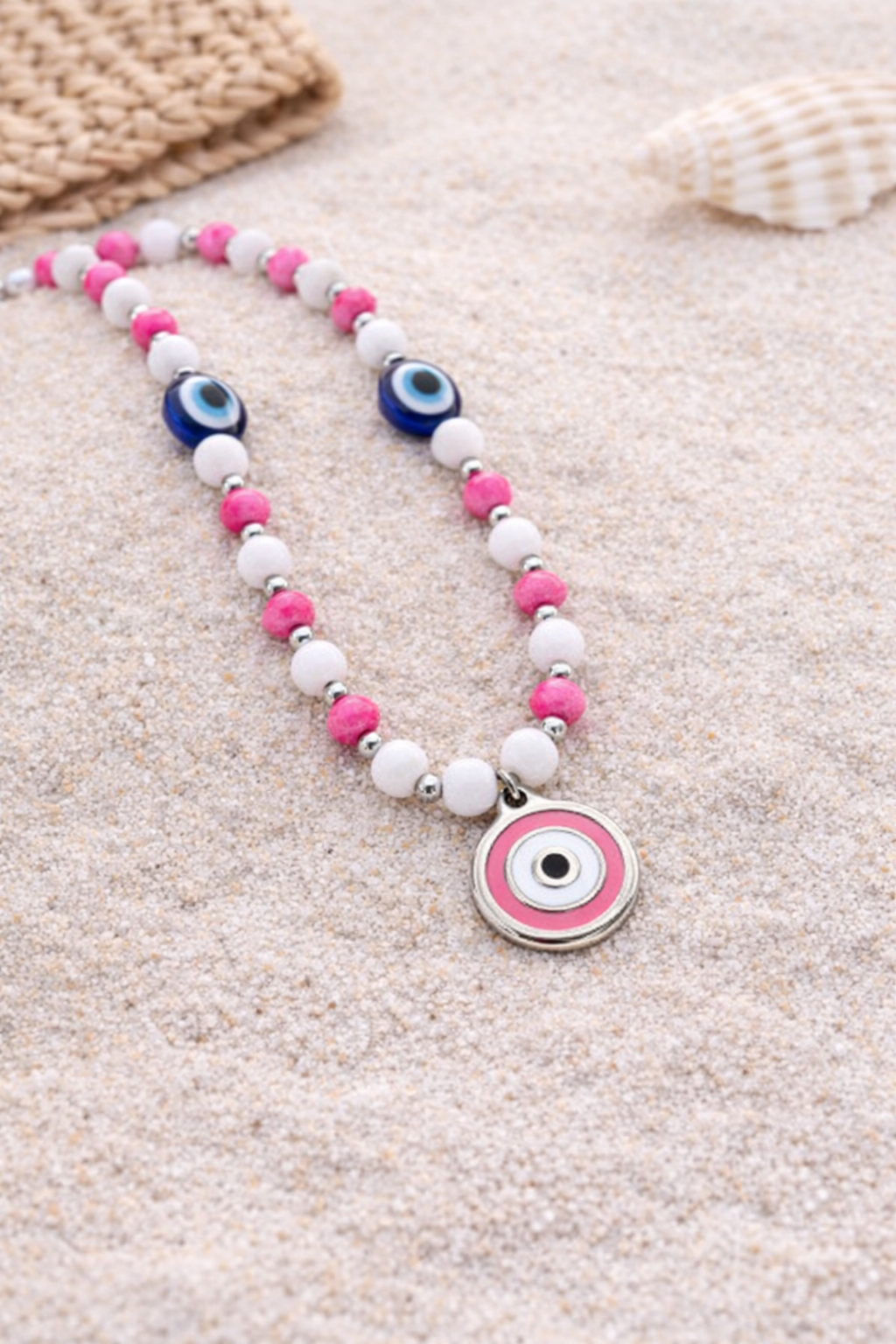 pink evil eye phone charm