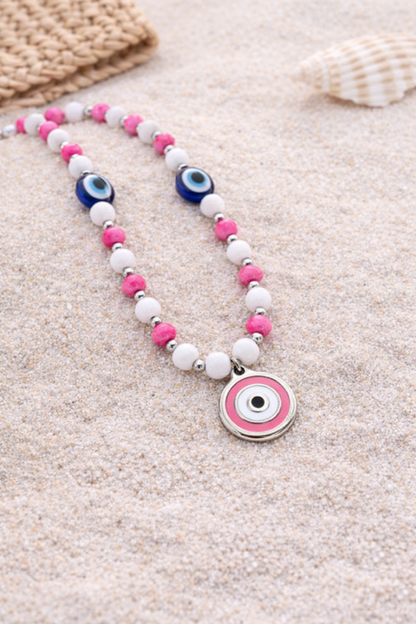 pink evil eye phone charm