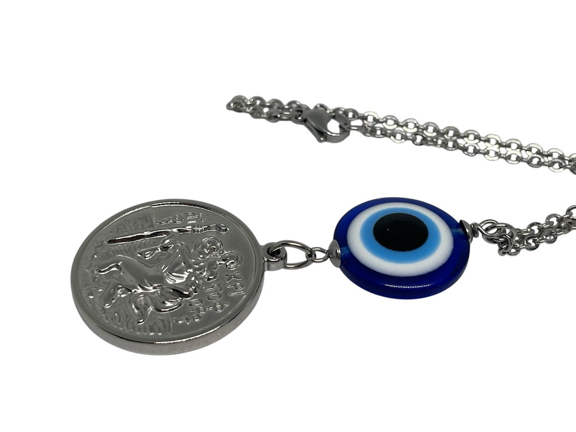 Necklace with a round silver pendant and a blue evil eye charm on a white background