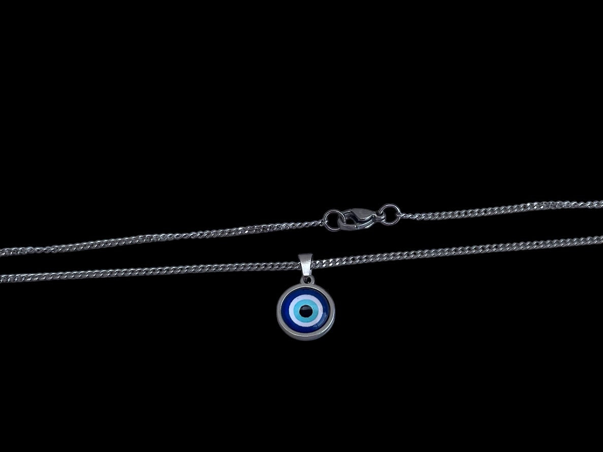 A stainless steel curb chain necklace with a round blue glass evil eye charm pendant.