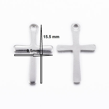 Two silver cross pendants with measurements on a white background