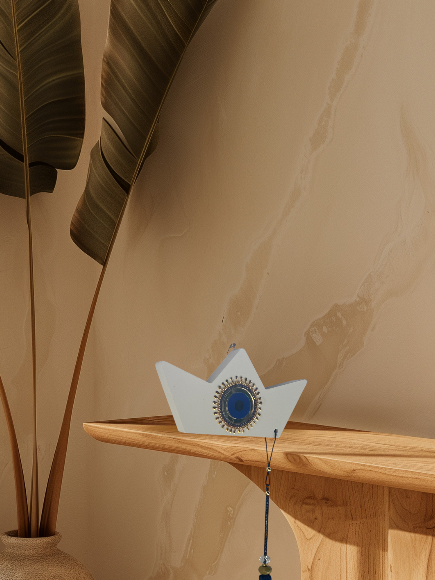 Decorative object on a wooden shelf with a plant in the background